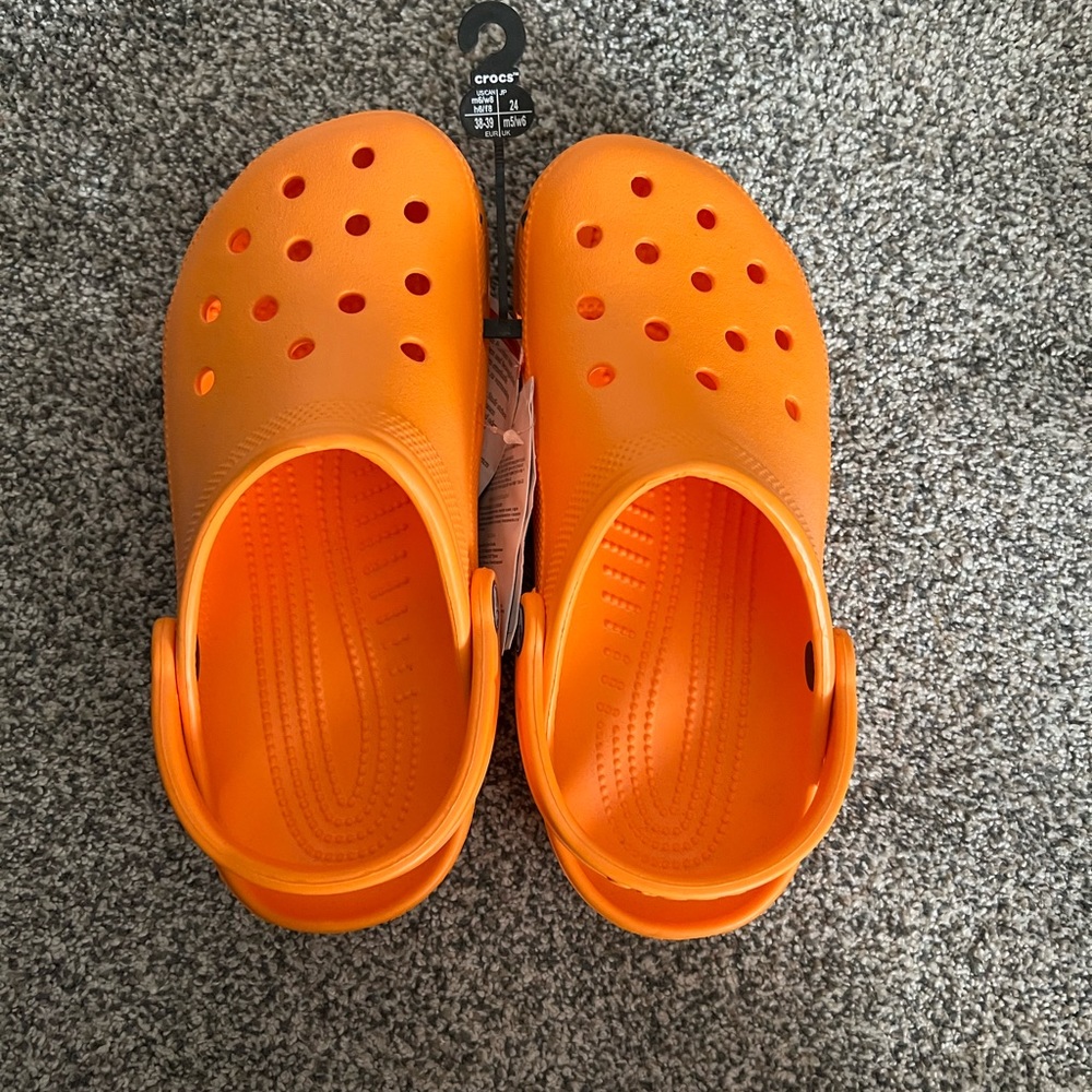 Bright orange crocs